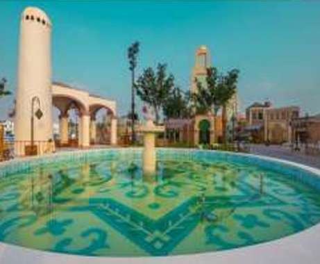 Tiled fountain pool in a themed plaza at Boulevard World