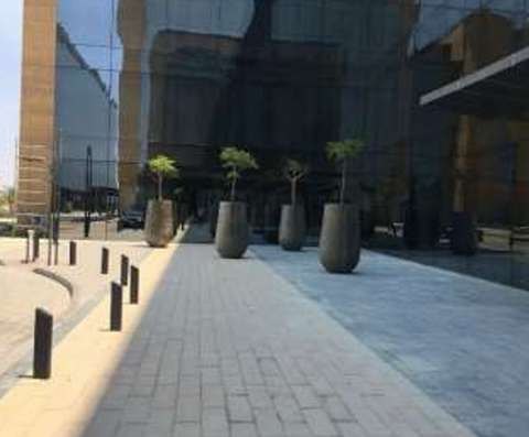Row of feature planters along the hotel facade